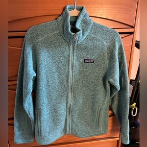 Patagonia women’s zip up in medium. Color light teal colored